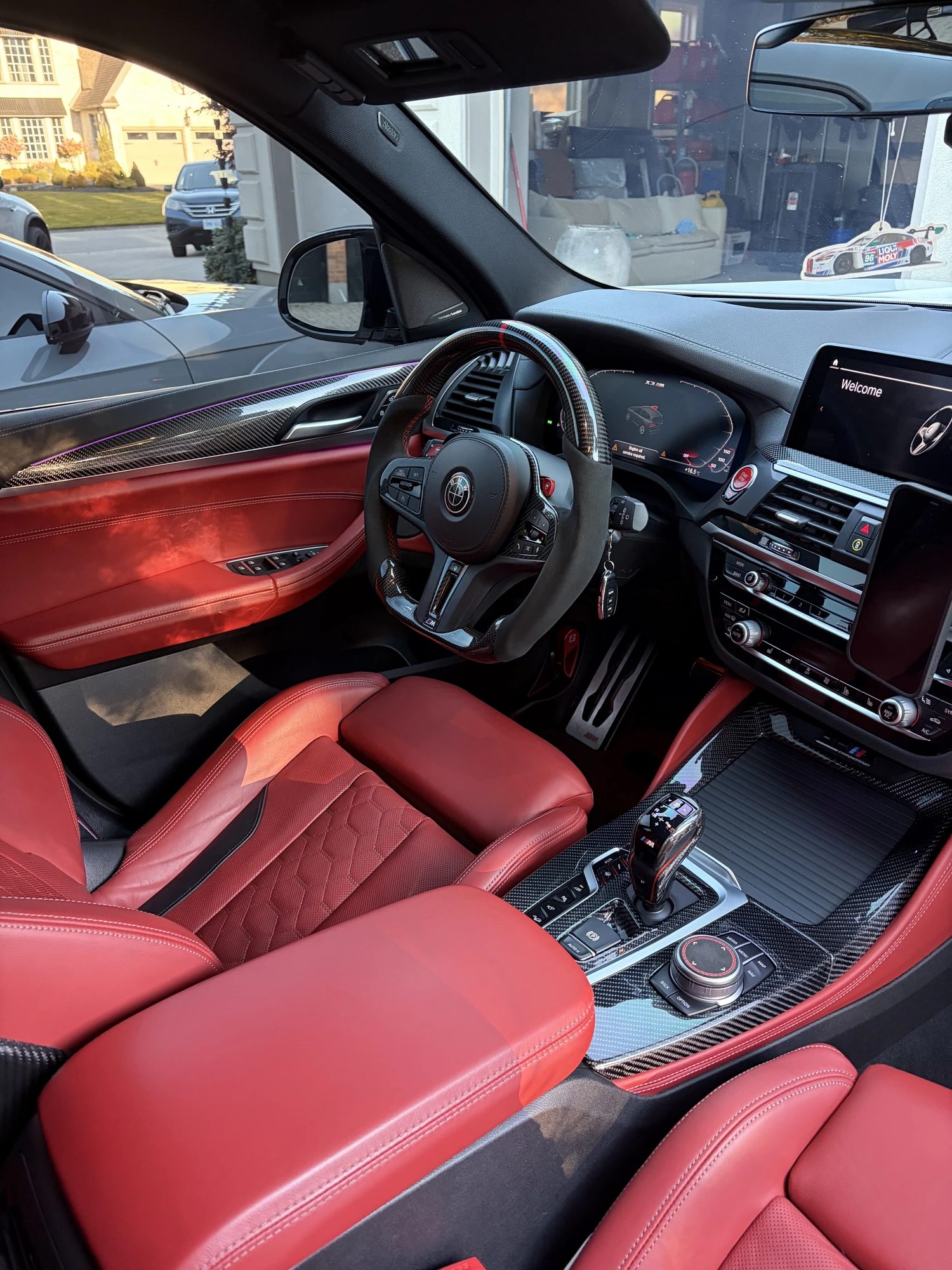 Red leather BMW M interior after an interior detail by Unreal Auto Spa