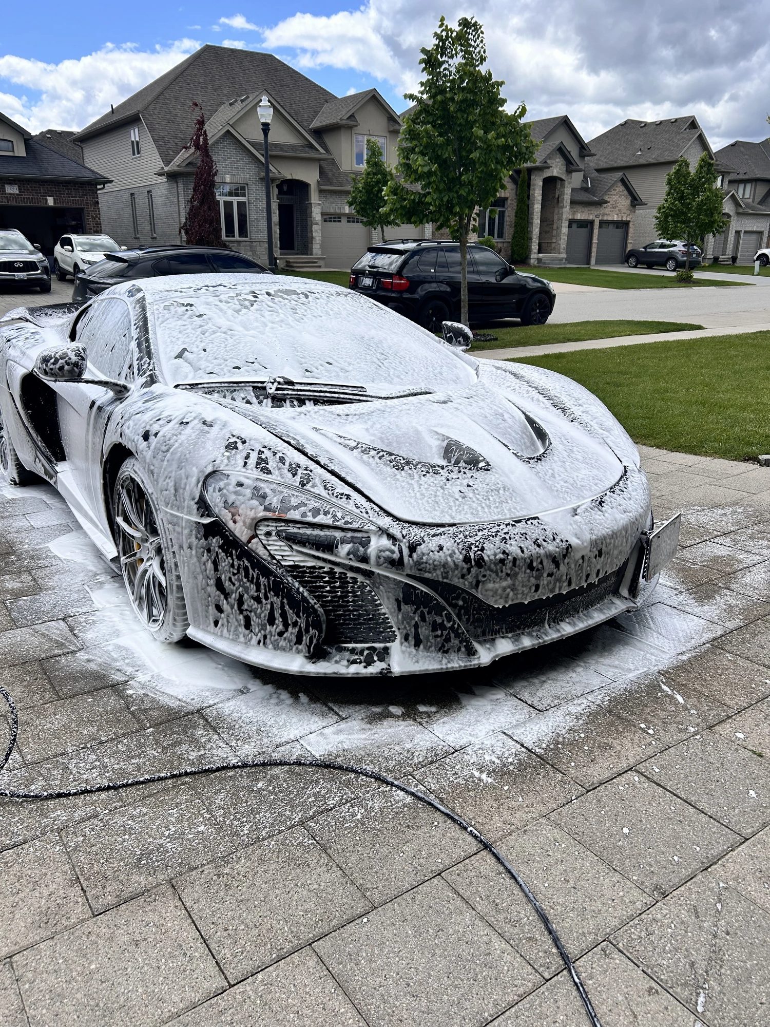 McLaren covered in thick foam during a safe hand wash by Unreal Auto Spa